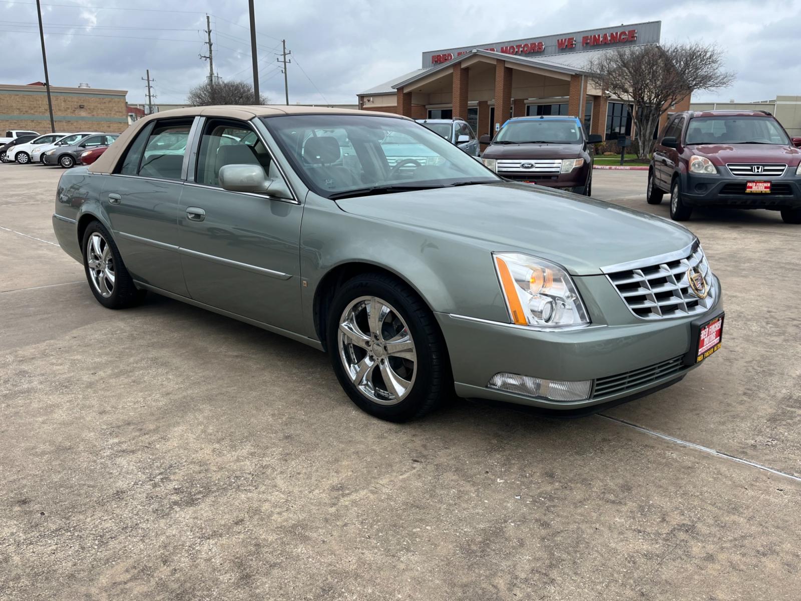 2006 green /TAN Cadillac DTS Sedan (1G6KD57Y96U) with an 4.6L V8 DOHC 32V engine, 4-Speed Automatic Overdrive transmission, located at 14700 Tomball Parkway 249, Houston, TX, 77086, (281) 444-2200, 29.928619, -95.504074 - Photo #0